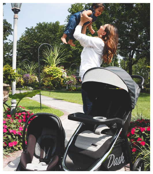 Woman Holding Baby - Dash Travel System by Monbebe